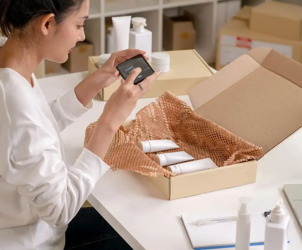 Ecommerce seller checking product packaging and product details for dropshipping video ads