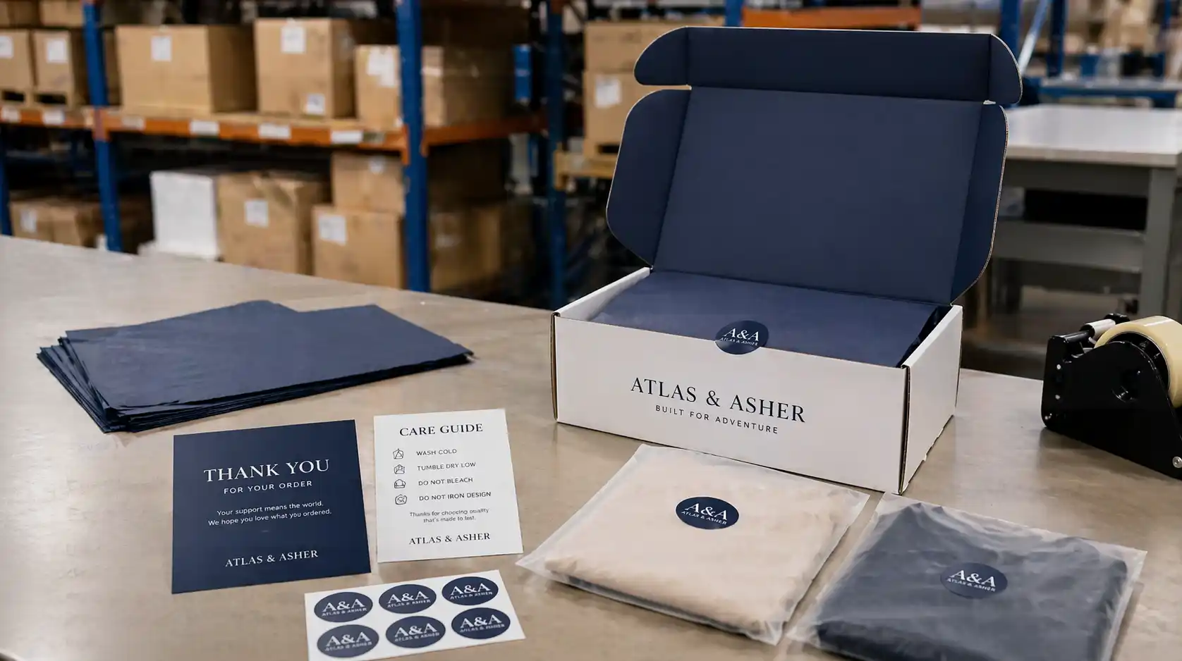 Brand-ready Shopify private label packout with insert cards, care guide, stickers, and branded packaging on a warehouse packing table
