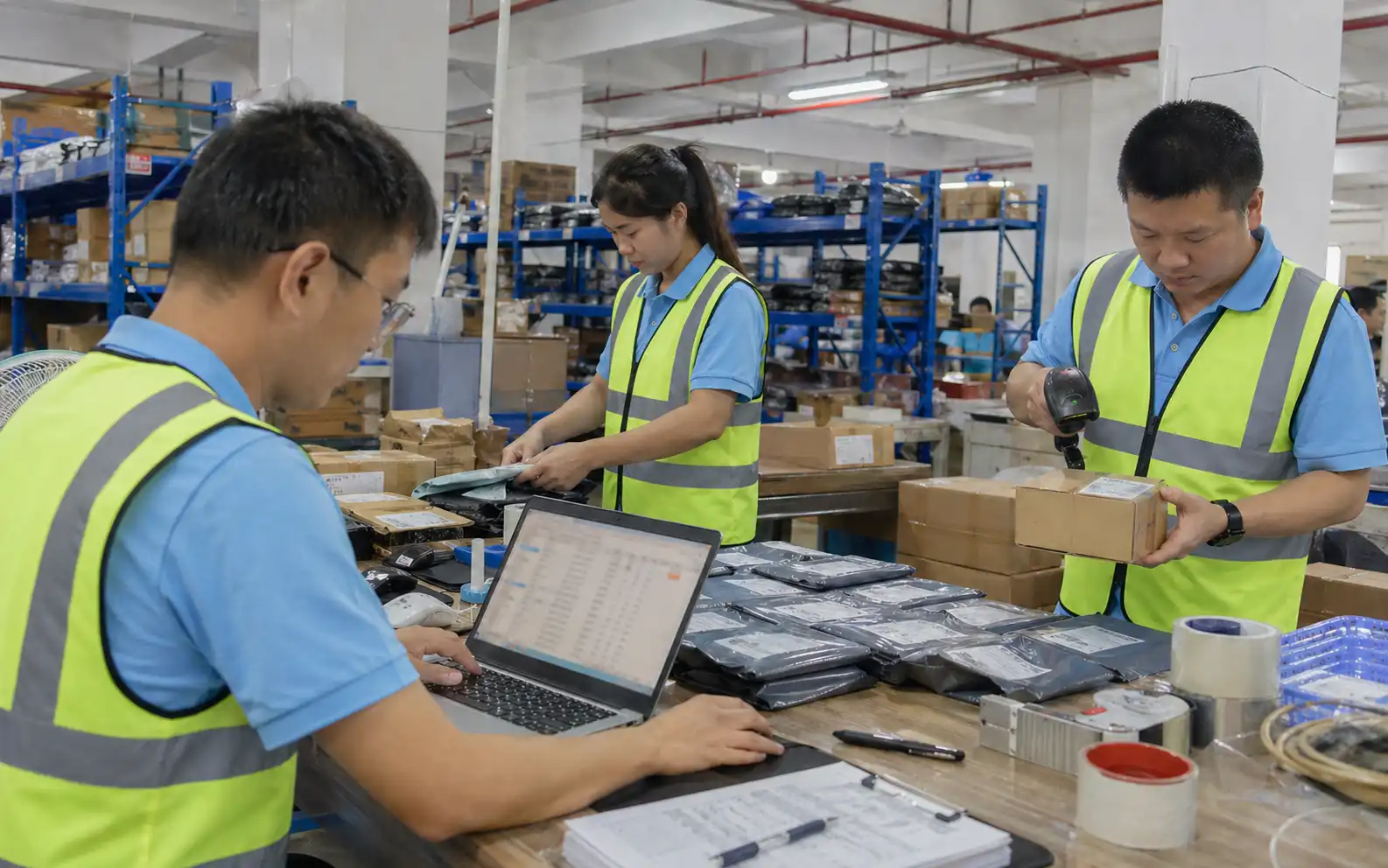 RuntoDropship team scanning, packing and managing TikTok Shop orders in a China warehouse